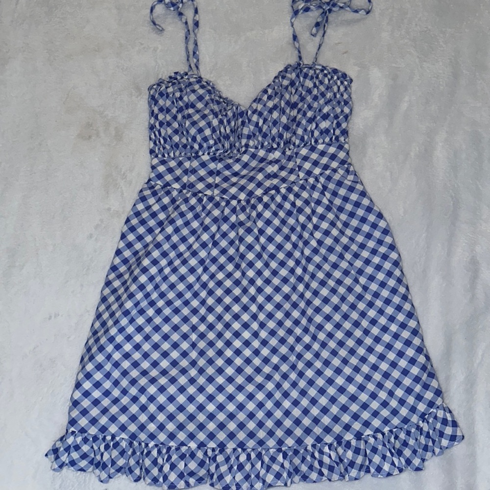 Summer style is a snap with this easy, strappy, perfectly smocked mini dress.